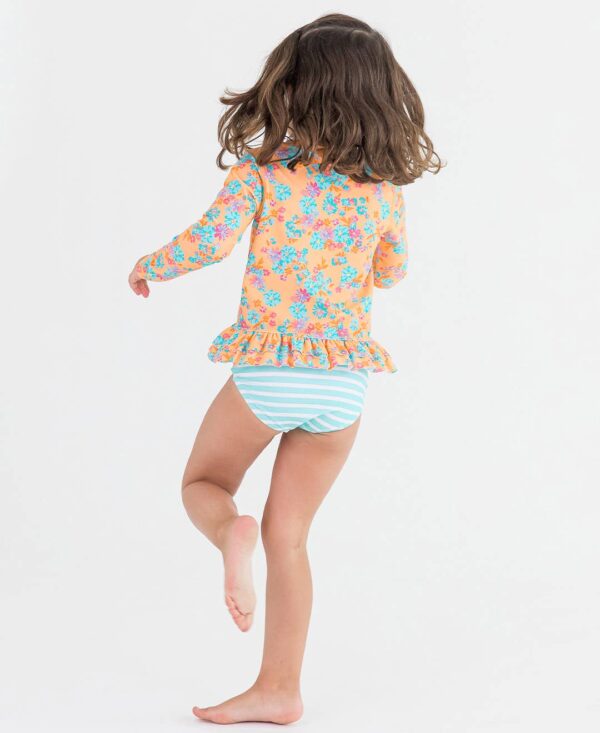 rufflebutts vibrant valley long sleeve ruffle hem rash guard 2 piece: Girl wearing floral swimsuit and striped bottoms.
