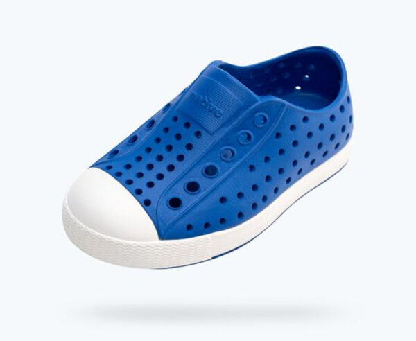 Blue perforated slip-on shoe with white sole.