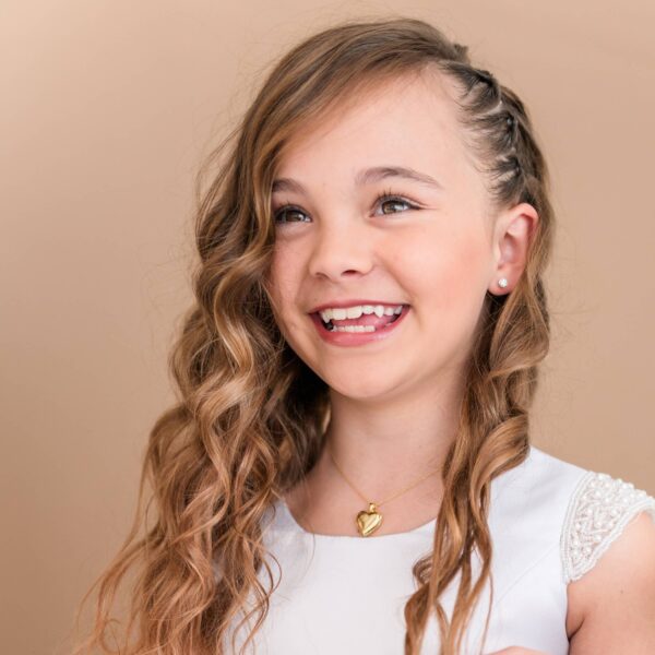 cherished moments 14k gold plated heart locket for little girls and kids: 14 inch Smiling girl with curly hair wearing a necklace.