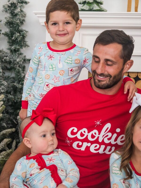 rufflebutts santa sweets pajamas Family in matching holiday pajamas smiling together.