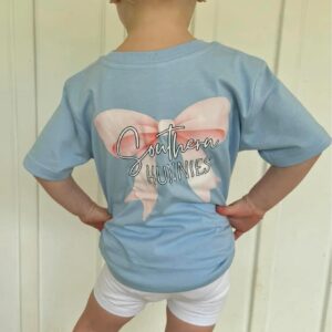 Child wearing Southern Hunnies shirt with pink bow.