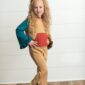 Child in colorful outfit posing indoors.