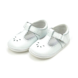 White baby shoes with decorative holes