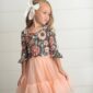 Girl in floral dress with peach tutu
