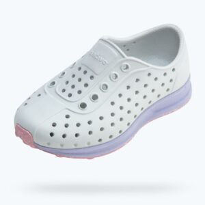 White perforated sneaker with colored sole.