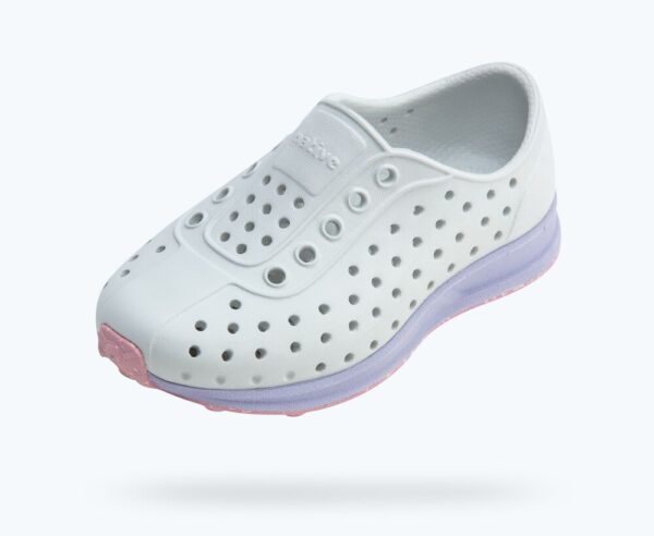 White perforated sneaker with colored sole.