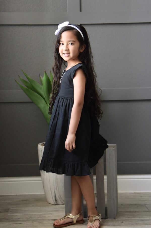 yo baby black angel sleeves shift dress Child in black dress and white headband