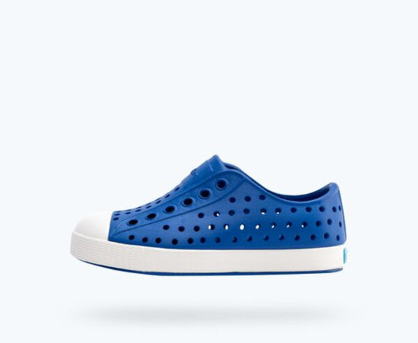 native jefferson uv blue Blue perforated slip-on sneaker with white sole.