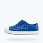 Blue perforated slip-on sneaker with white sole.