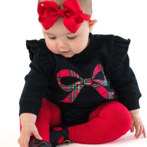 Baby in red bow and festive outfit