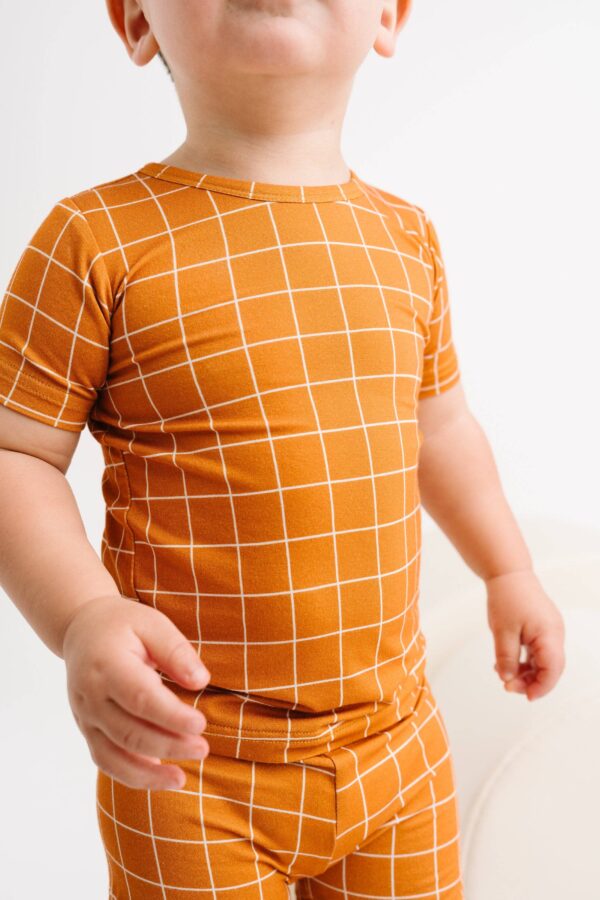 little one shop rust checks bamboo shorts set Child in orange checkered outfit.