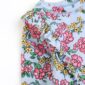 Floral pattern, blue fabric with pink and yellow flowers.