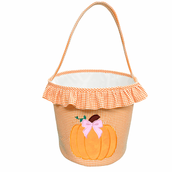 bits & bows halloween ruffled pumpkin tote Orange pumpkin basket with pink bow decoration.