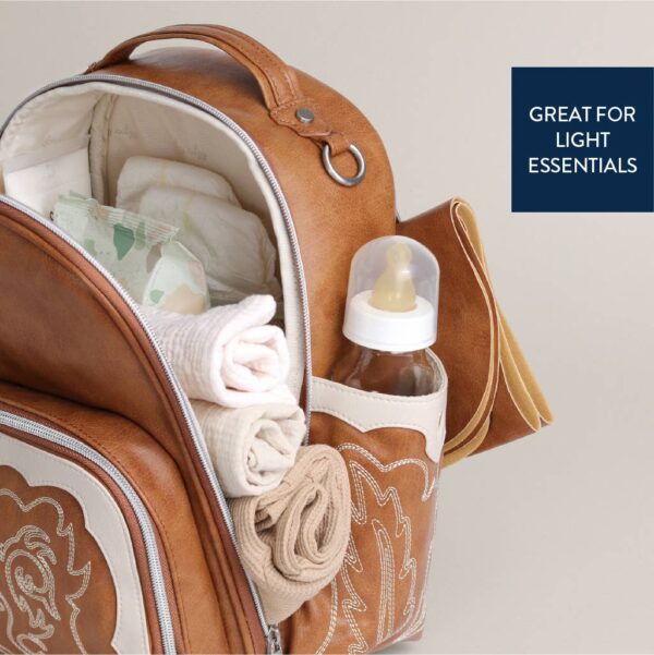 itzy ritzy nash mini plus™ backpack diaper bag Leather diaper bag with essentials inside and pockets.