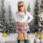 Smiling girl in festive holiday outfit and sunglasses.
