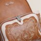 Brown embroidered backpack with zipper detail