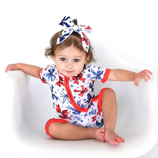 gigi and max eleanor bow clip bow 4th of july hair accessory Baby in patriotic outfit with matching headband.