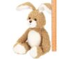 Fuzzy plush bunny with ruler for size reference.