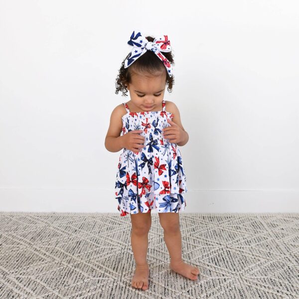 gigi and max eleanor bow clip bow 4th of july hair accessory Child in butterfly print dress and matching headband.