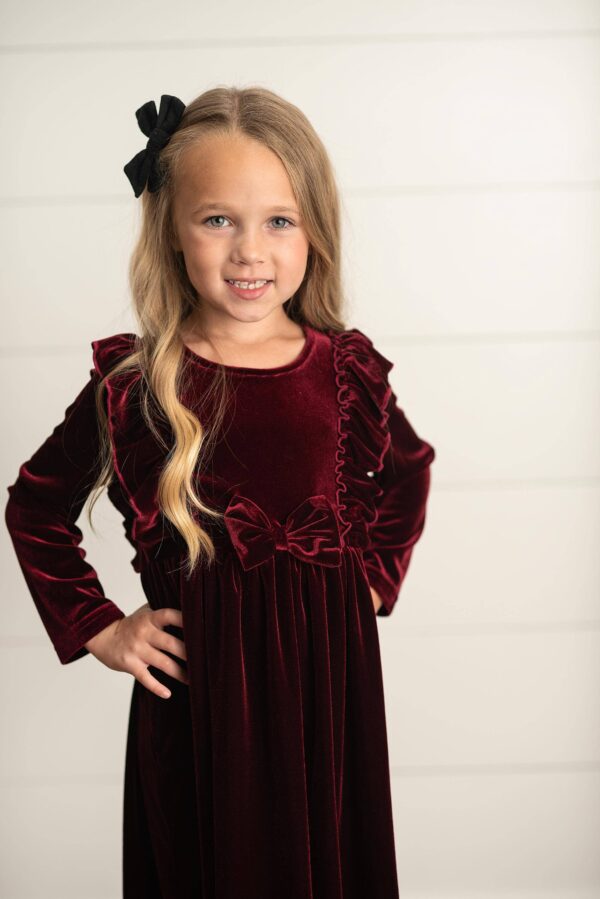 oopsie daisy kids burgundy wine velvet bow ruffle holiday party dress Girl in velvet dress with black bow