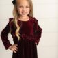 Girl in velvet dress with black bow