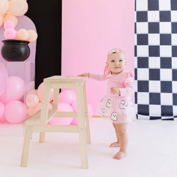 sweet wink girly ghost halloween bow baby headband Baby in pink dress with balloons and step stool.