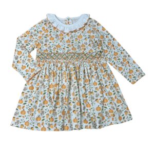 Pumpkin pattern dress with ruffled collar.