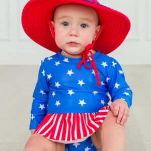 Baby in patriotic outfit with red hat