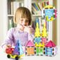 Child enjoying colorful magnetic building blocks.