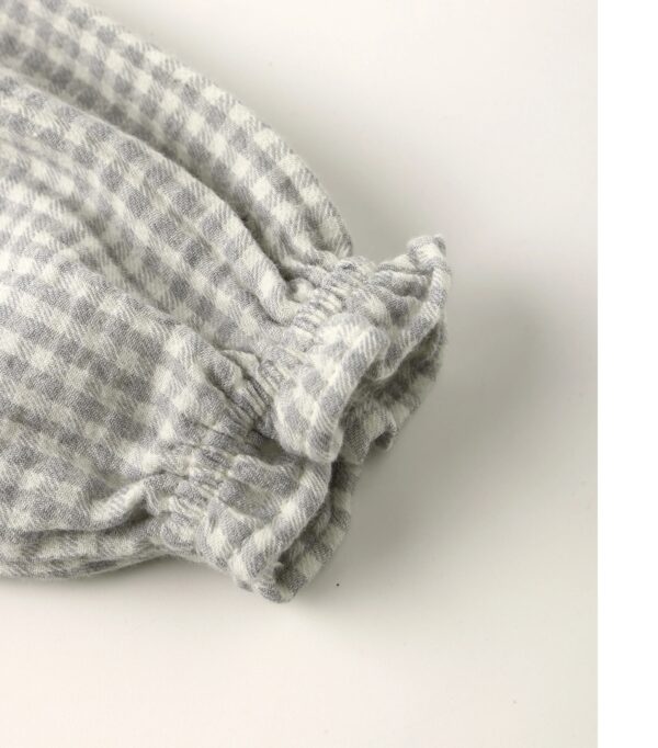 quincy mae eden romper blue gingham Gray checkered fabric with elastic cuffs detail.
