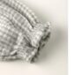 Gray checkered fabric with elastic cuffs detail.