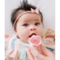 Baby with pacifier and headband