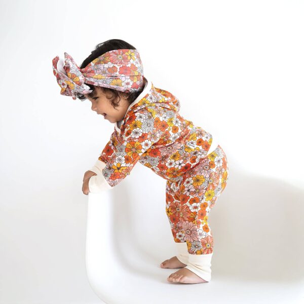 gigi and max louisa hoodie set Toddler in floral outfit standing on chair