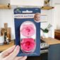 Pink pacifiers in kitchen setting.