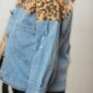 Denim jacket with leopard print detail.