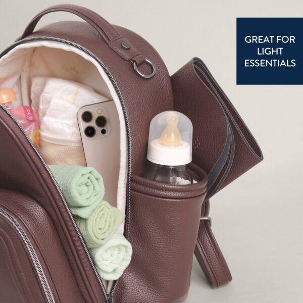 itzy ritzy *new* espresso itzy mini plus™ Brown diaper bag with baby essentials inside.