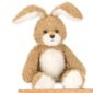 Fluffy stuffed bunny with ruler for size reference.
