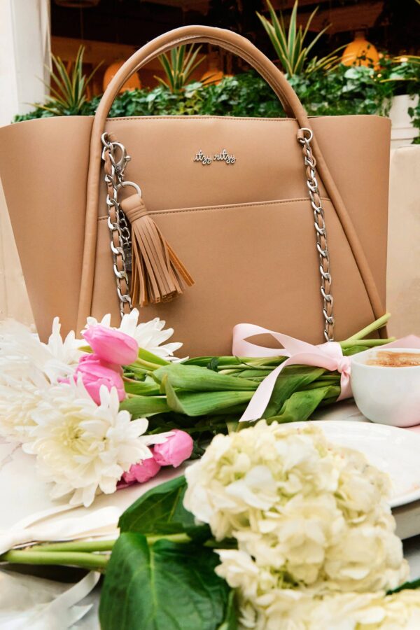 itzy ritzy *new/restocked* chai latte boss tote™ Stylish beige handbag with flowers and coffee.