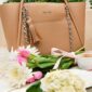 Stylish beige handbag with flowers and coffee.