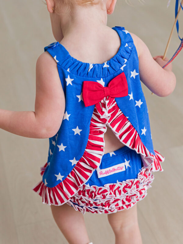 rufflebutts stars and stripes swing set Baby wearing patriotic star and stripe outfit