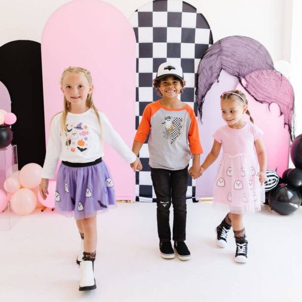 sweet wink ghost and bat sequin halloween tutu Three kids in Halloween-themed clothes holding hands.