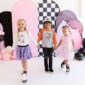Three kids in Halloween-themed clothes holding hands.