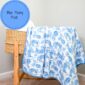 Blue peony print blanket on wicker basket