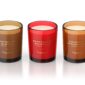 Three scented candles in different colors