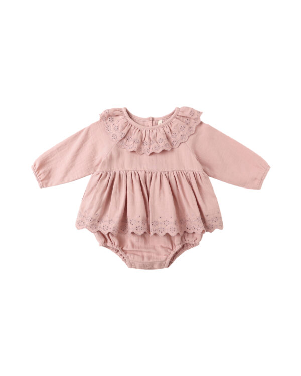 Pink baby dress with lace details.
