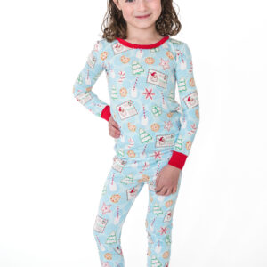 Child wearing festive Christmas pajamas.