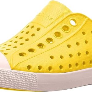 Yellow perforated casual shoe with white sole.