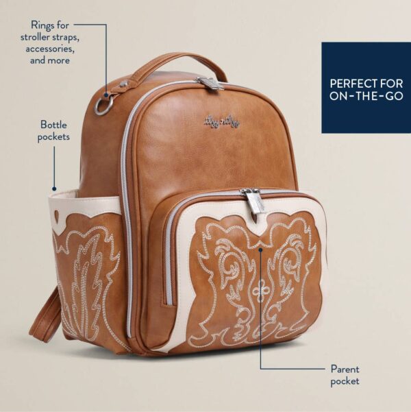 itzy ritzy nash mini plus™ backpack diaper bag Brown leather backpack with decorative embroidery.