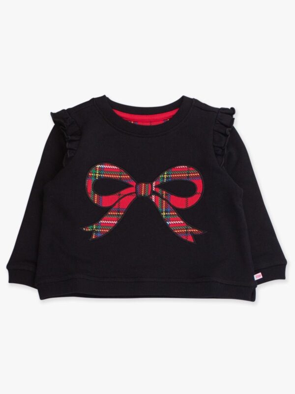 Black sweater with plaid bow design.