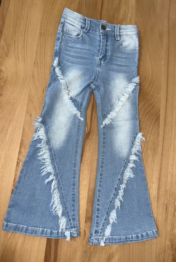 ml kids fringe flare jeans Blue flared jeans with frayed seams on floor